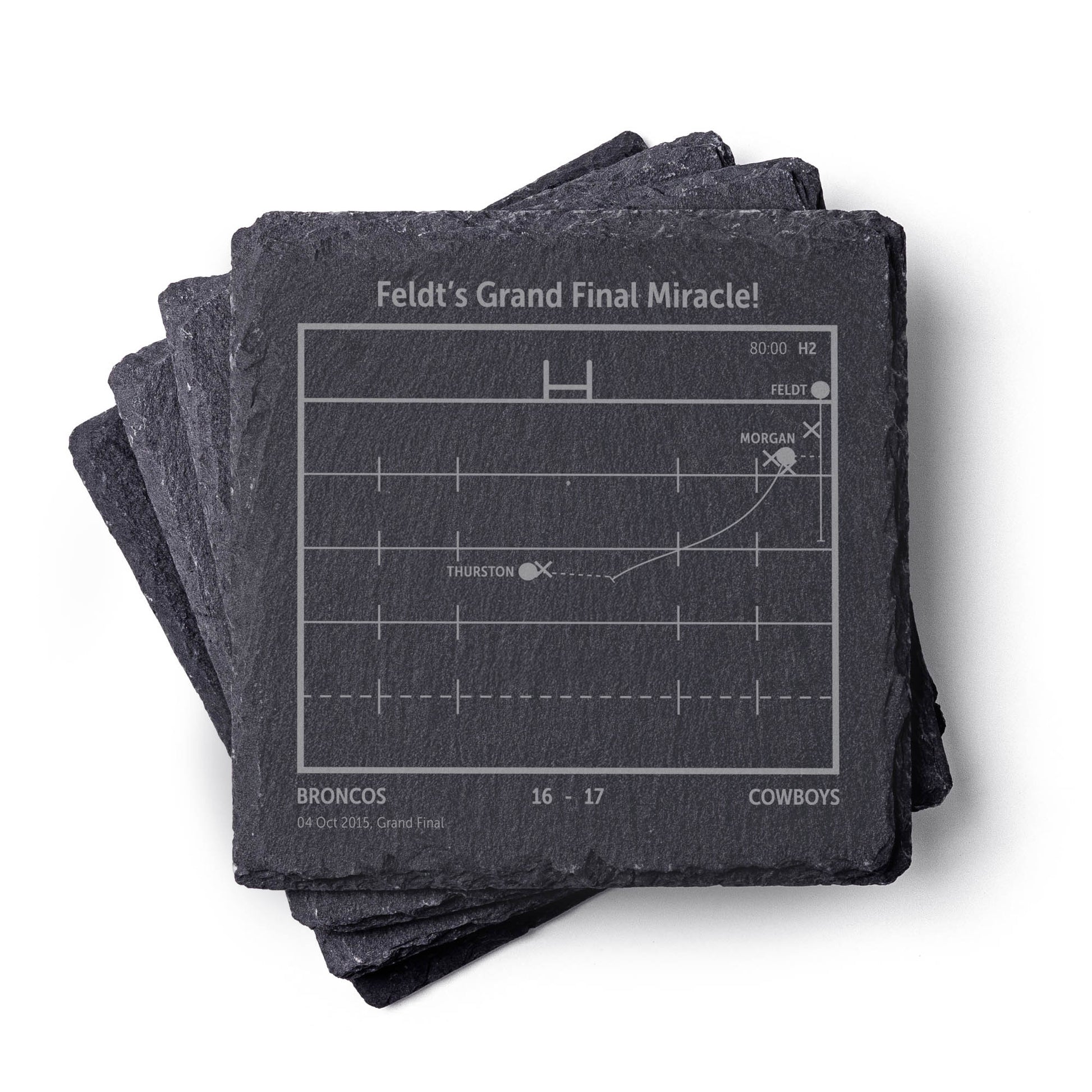 Stack of NQLD Cowboys NRL slate coasters with engraved playbook sports design and text on a white background